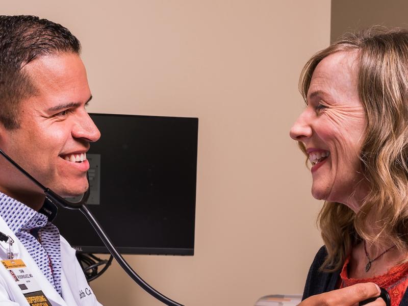 Doctor listening to patients heart