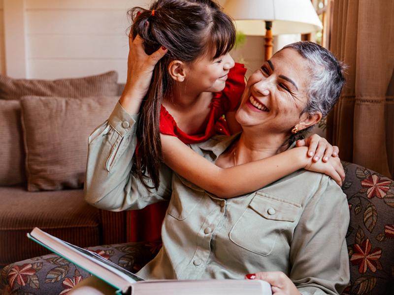 Young girl hugging her grandmother