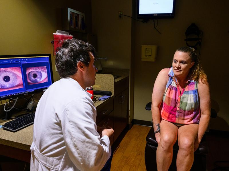 A photo of a woman speaking with a physician.