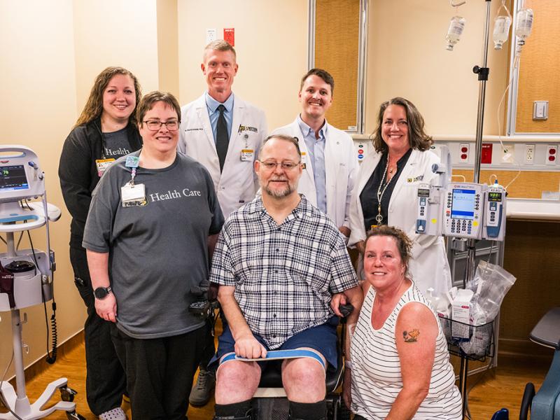 A photo of Toby with his family and MUHC faculty.