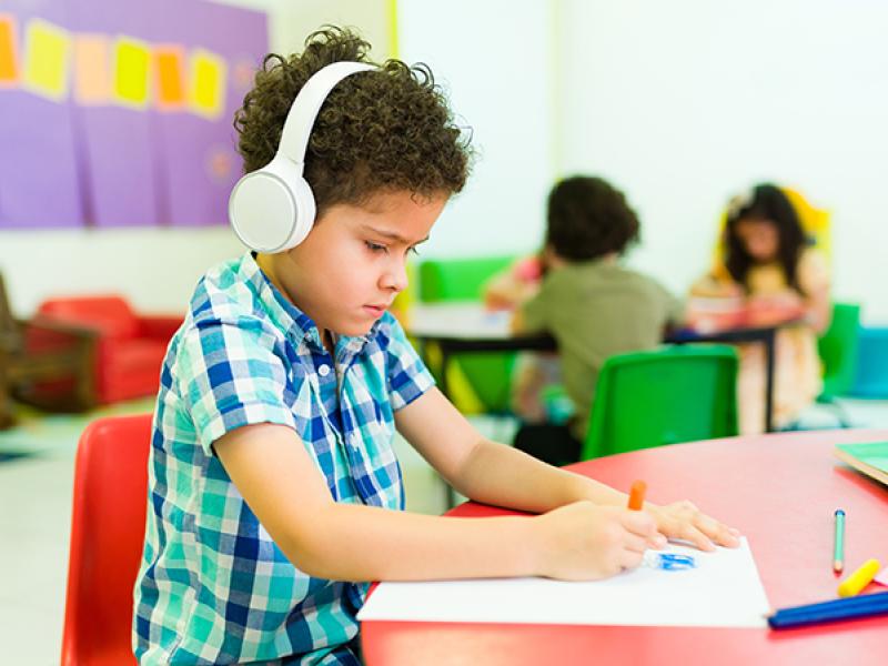 young boy wearing headphones