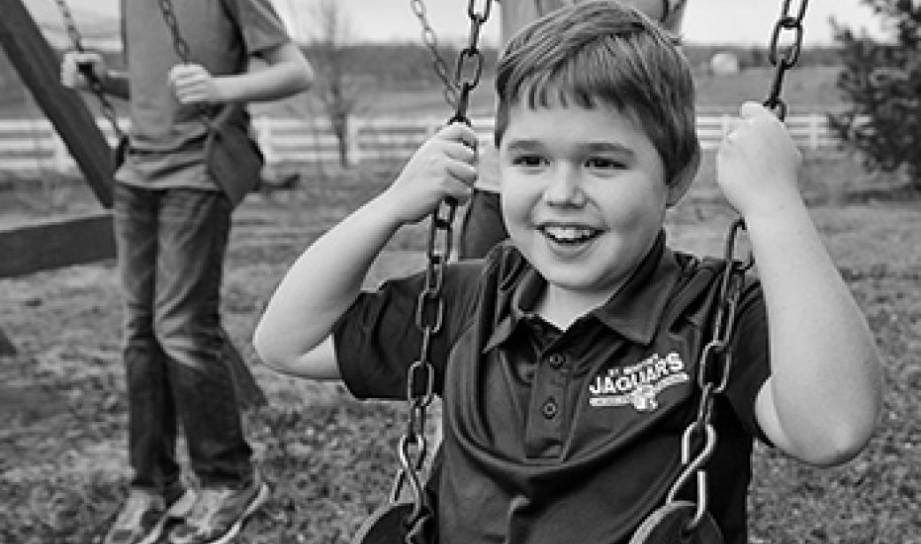 Young boy on a swing