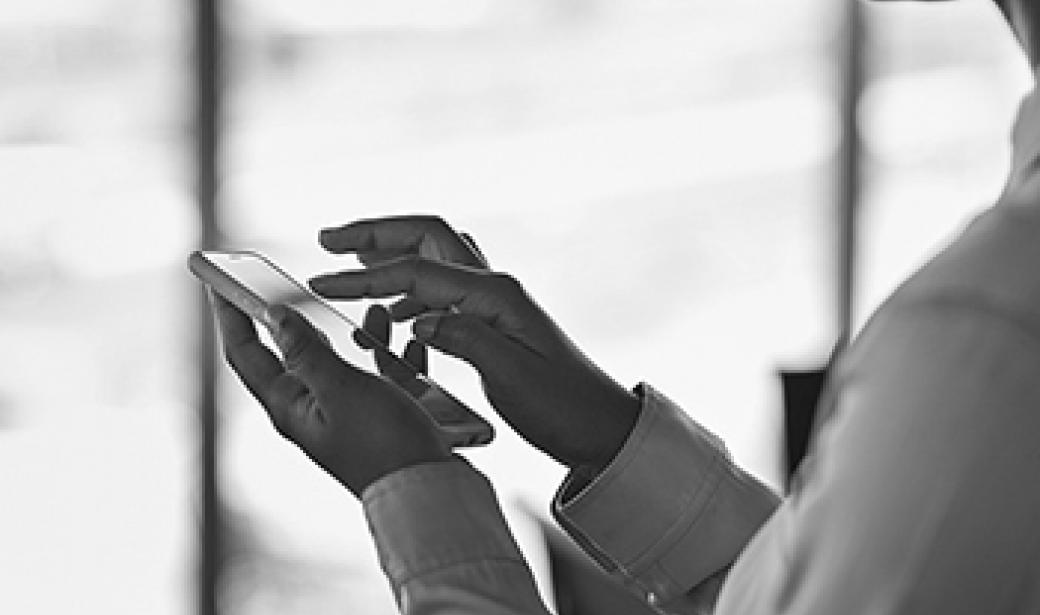 Photo of woman holding a smartphone