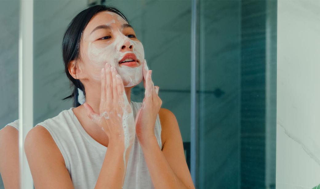 woman washing her face
