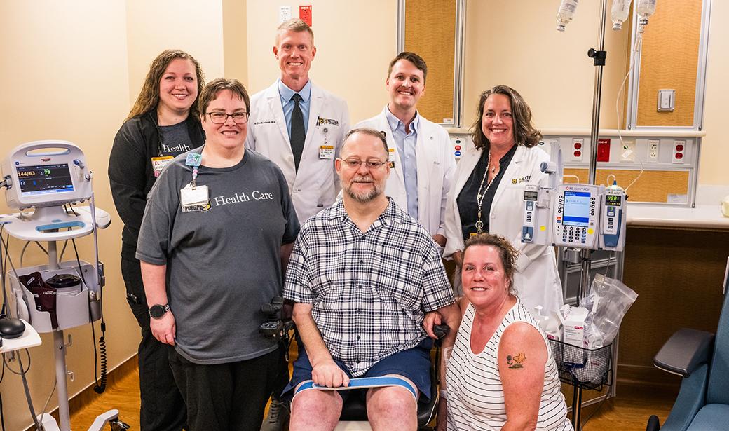 A photo of Toby with his family and MUHC faculty.