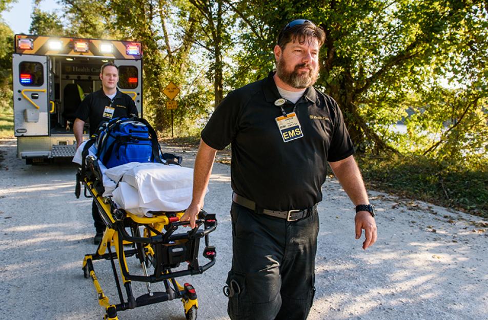 EMS wheeling a stretcher from an ambulance