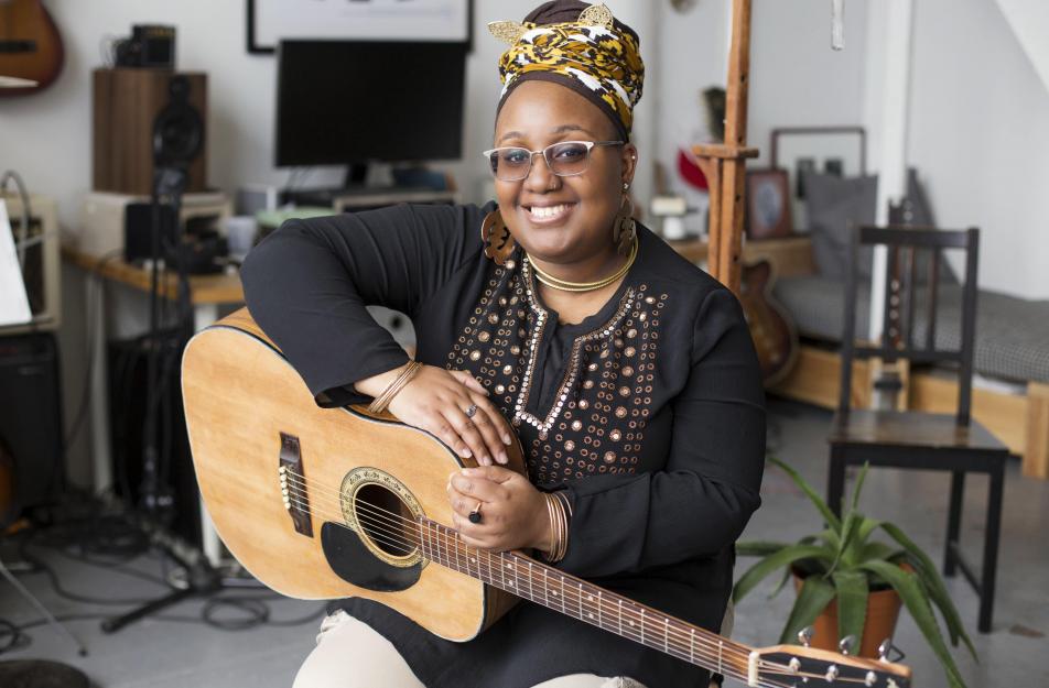 woman holding guitar