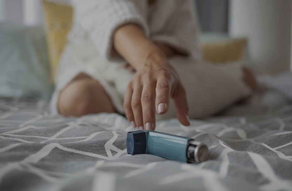 woman reaching for an inhaler