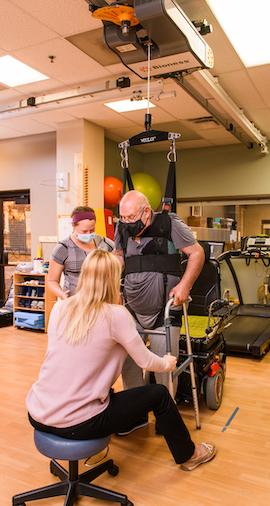 photo of mu health care neurologic physical therapists working with patient