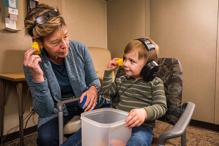 photo of audiologist and patient
