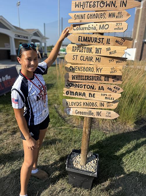Arielle Rhodes points home to Columbia at the Little League Softball regional tournament, held in Whitesdown, Ind., in July of 2026.