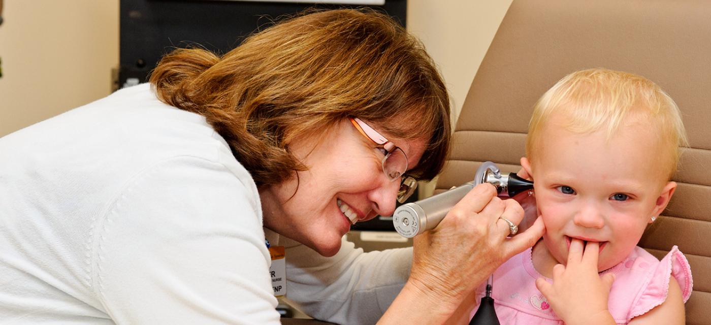 Photo of Jane Cooper, FNP, with patient